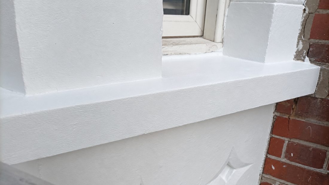 Exterior windowsill after repainting